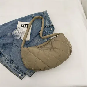 Chic khaki quilted puffer crossbody bag with elegant diamond stitching and wide strap