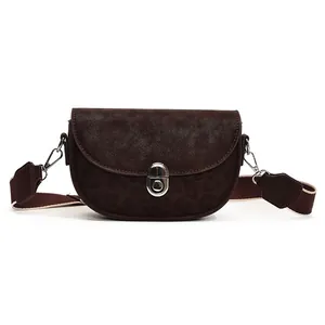 Retro dark brown suede saddle bag with leopard print accent and wide shoulder strap