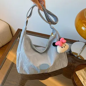 Light blue large capacity nylon hobo bag with adjustable strap and cute plush charm