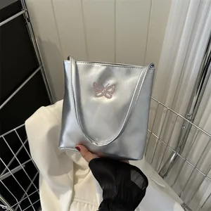 Stylish silver metallic tote bag for women with elegant pink butterfly embroidery detail