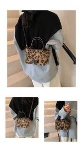Detail of leopard print plush bag showing faux fur texture and dark leather label