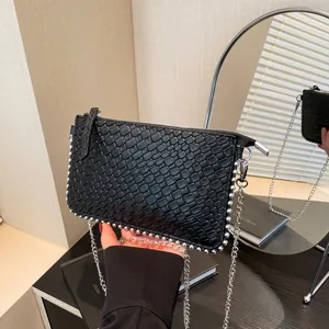 Chic black woven leather shoulder bag with silver bead studs and metal chain strap