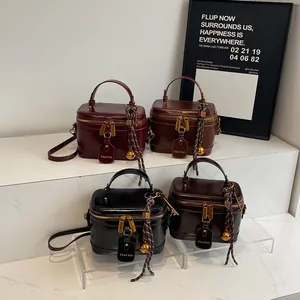 Retro leather mini bucket bags in four colors with gold zippers and long straps