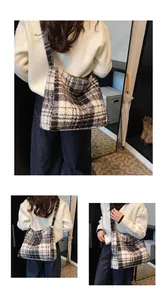 Close-up of black and white plaid wool tote bag showing thick tweed fabric texture