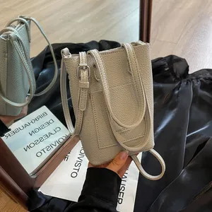 Mini Sac Seau pour Femmes en Cuir PU Grain de Galet Sac Bandoulière Petit Sac à Main Pochette de Téléphone Avec Poche Avant et Bandoulière Réglable