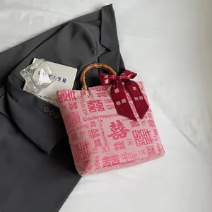 Pink canvas wedding tote bag with bamboo handles and decorative double happiness silk scarf