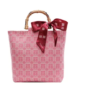 Pink canvas tote with bamboo handle, red silk bow and traditional double happiness pattern