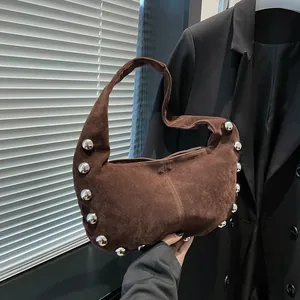 Retro dark brown suede underarm bag with silver stud rivets and a moon-shaped silhouette