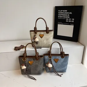 Retro leather tote bag with cylindrical handles and ice cream charm in three colors