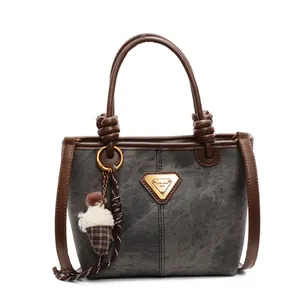 Retro grey canvas tote bag with brown leather trim and ice cream plush pendant