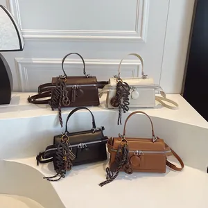 Chic multi-color faux leather crossbody pillow bags with dual zippers and Bonny pendants