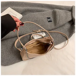 Minimalist nude underarm bag with silver chain and adjustable strap for women