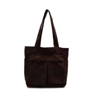 Brown corduroy tote bag with dual front pockets and large capacity shoulder straps