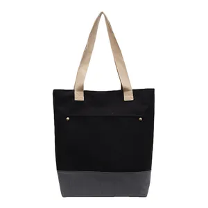Minimalist canvas tote bag in black and grey with beige handles for daily commute