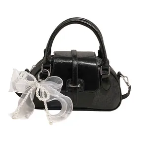 Retro black leather Boston bag with a white tulle bow and pearl charm for women