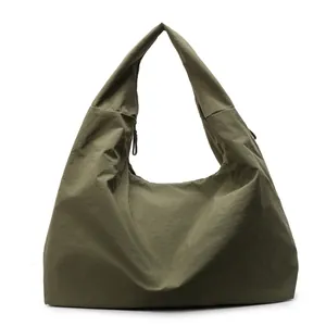 Army green large canvas tote bag with slouchy hobo style for casual daily commuting