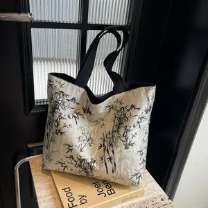 Minimalist tote bag with black bamboo ink pattern for daily commuting and shopping