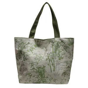 Large capacity tote bag with elegant bamboo print and green woven handles for daily use
