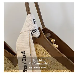 Detailed view of beige woven tote bag featuring brown faux leather handles and stitching craft