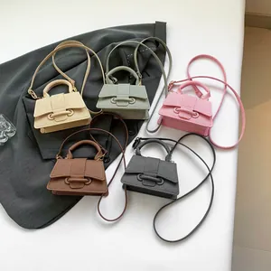 Mini textured crossbody handbag in 5 solid colors with top handle and elegant knot design