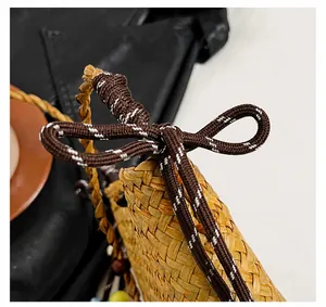 Detailed macro view of handcrafted straw weave texture with dark brown decorative bow tie