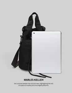 Close-up of black bucket bag featuring front mesh pocket and secure drawstring closure