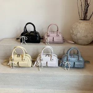 Boston bowling handbags for women in five colors with pearl bow charms and top handles