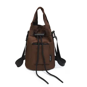 Brown drawstring bucket bag with adjustable straps for outdoor sports and yoga