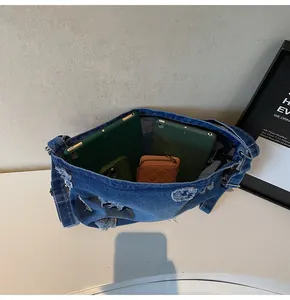 Top view of blue denim tote showing large capacity storage for iPad and accessories