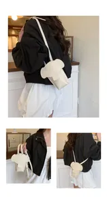 Detail view of a cream white elephant-shaped mini crossbody phone bag for women