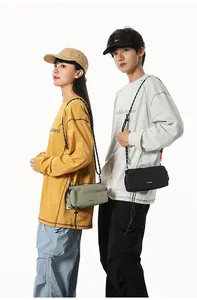 Detail of waterproof nylon crossbody bag with woven rope strap and metal buckle