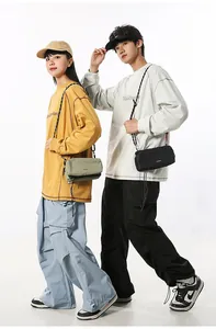 Outdoor techwear crossbody bag detail showing adjustable straps and nylon finish