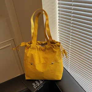 Large capacity yellow waterproof nylon tote bag with drawstring for women