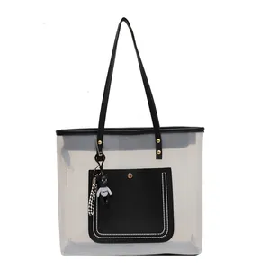 Large transparent PVC tote bag with black leather trim and cute bear keychain charm