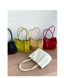 Close-up of luxury large capacity tote bags in five vibrant colors with lychee grain texture