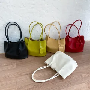 Minimalist large leather tote bag set in five colors with long handles and charms