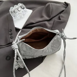 Silver grey pleated hobo bag with rope straps and spacious interior for daily commute