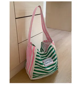 Detailed close-up of colorful striped canvas tote bag showing thick texture and stitching