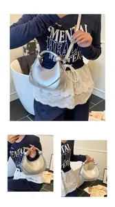 Silver crescent dumpling bag with knot handle, chain detail and white lace hem decoration