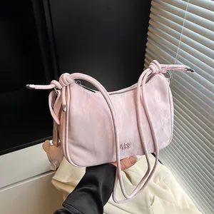 Pink pleated dumpling bag with knot strap and cute bear pendant for summer fashion