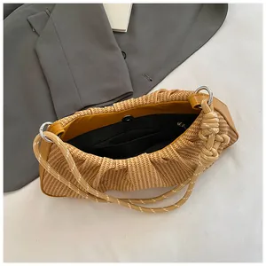 Detail view of khaki woven bag featuring internal zipper pocket and magnetic buckle