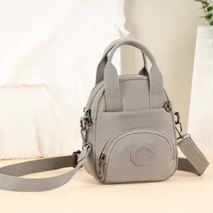 Wasserdichte graue Nylon-Handtasche für Damen mit Reißverschlusstaschen und Umhängegurt