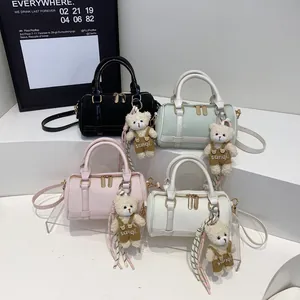 Mini Boston cylinder handbags in multiple colors with cute bear pendants for women