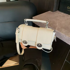 Elegant cream crocodile-pattern small square bag with silver C-locks and hand-held strap