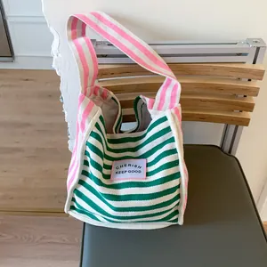Striped canvas tote bag in green and pink contrast colors with Cherish Keep Good patch