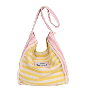 Striped canvas tote bag in yellow and pink patchwork design with large capacity