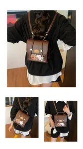 Mini sac à dos marron en cuir PU avec fenêtre transparente et peluches à l'intérieur