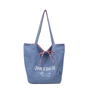 Striped denim tote bag with cartoon dog print and red-white checkered handles