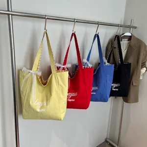 Minimalist canvas tote bags in four colors with lace bows and plaid lining for women