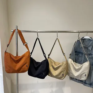 Large capacity nylon crescent tote bag in four colors with adjustable shoulder strap